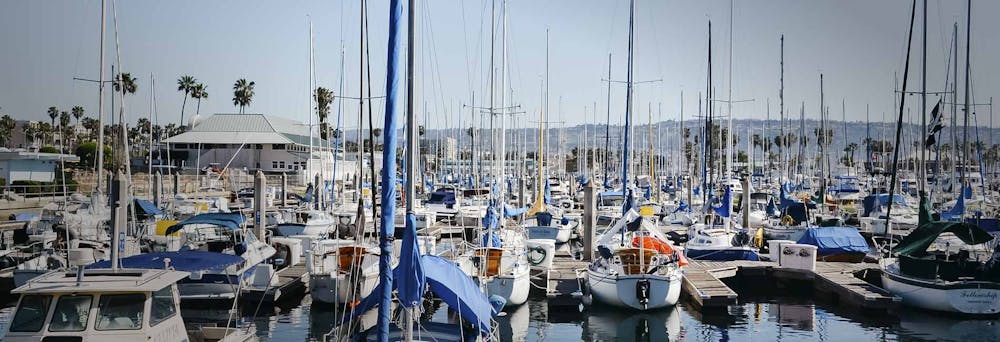 a boat is docked next to a body of water