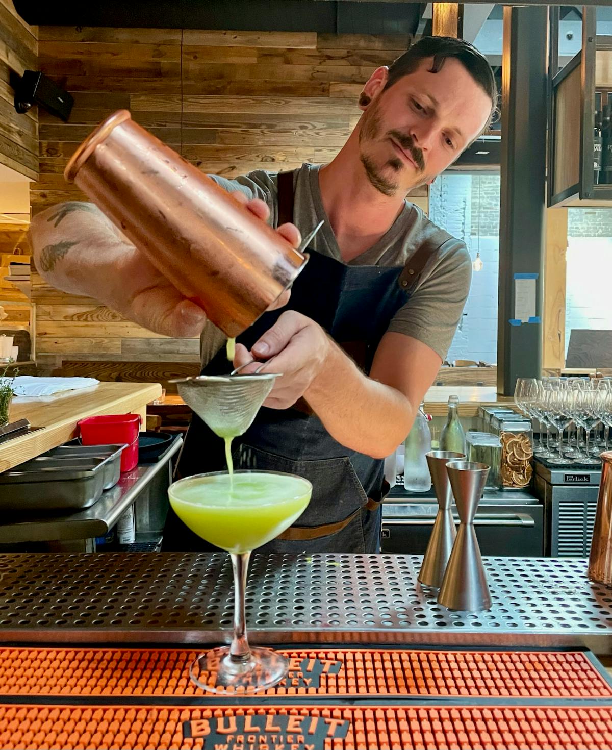 a person pouring a drink