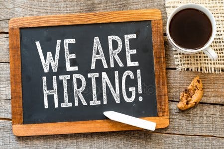 a sign on a wooden table