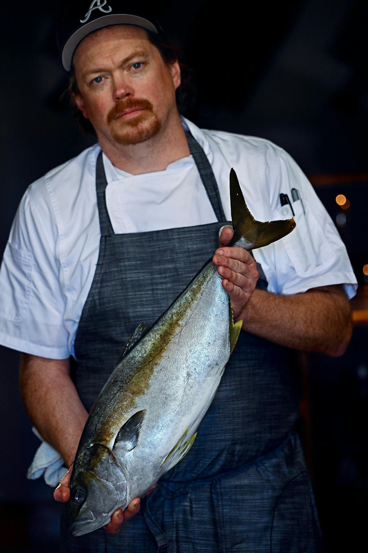 a man holding a fish