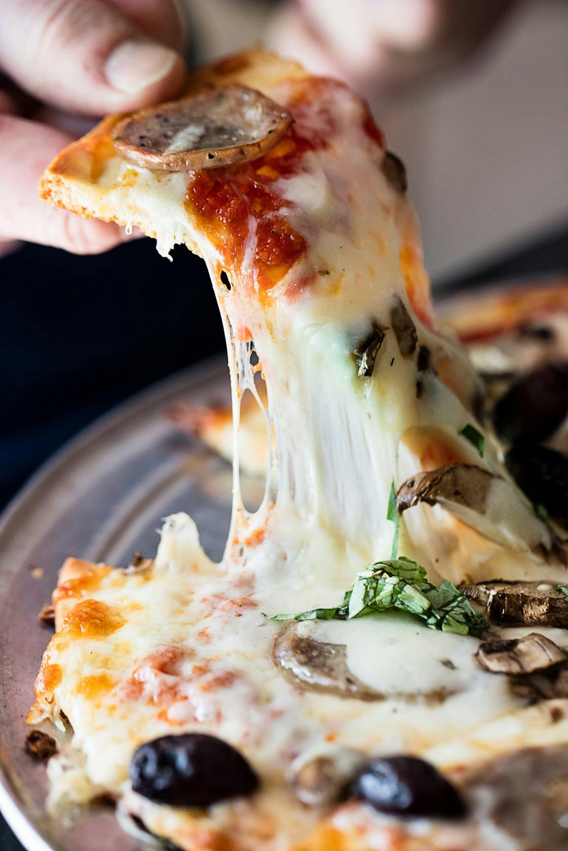 a close up of a slice of pizza