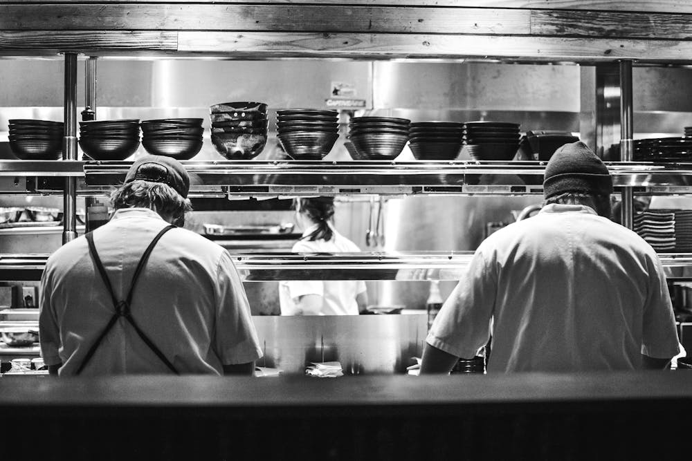 a man cooking in a kitchen preparing food