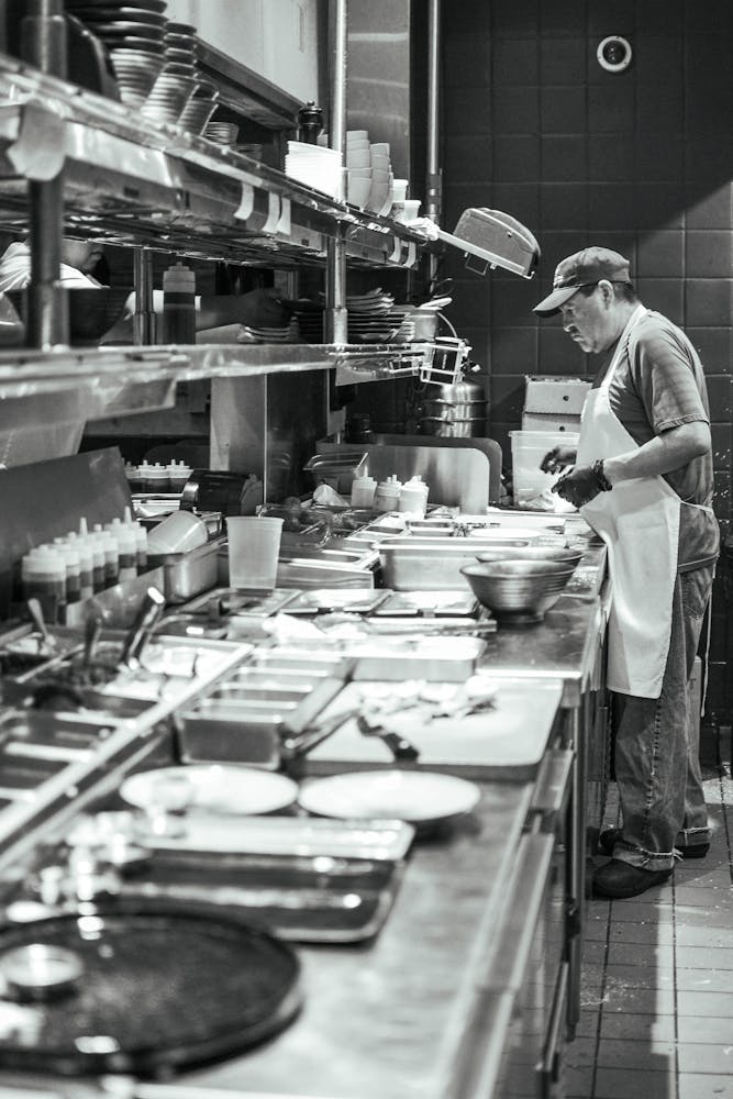 a person cooking in a kitchen preparing food