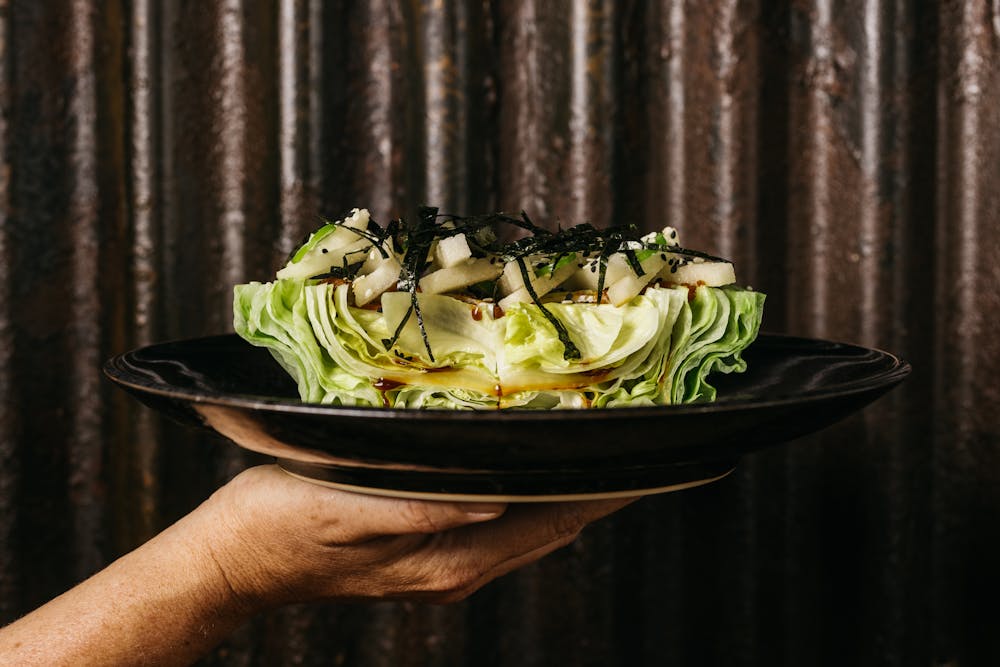 a person holding a bowl of food