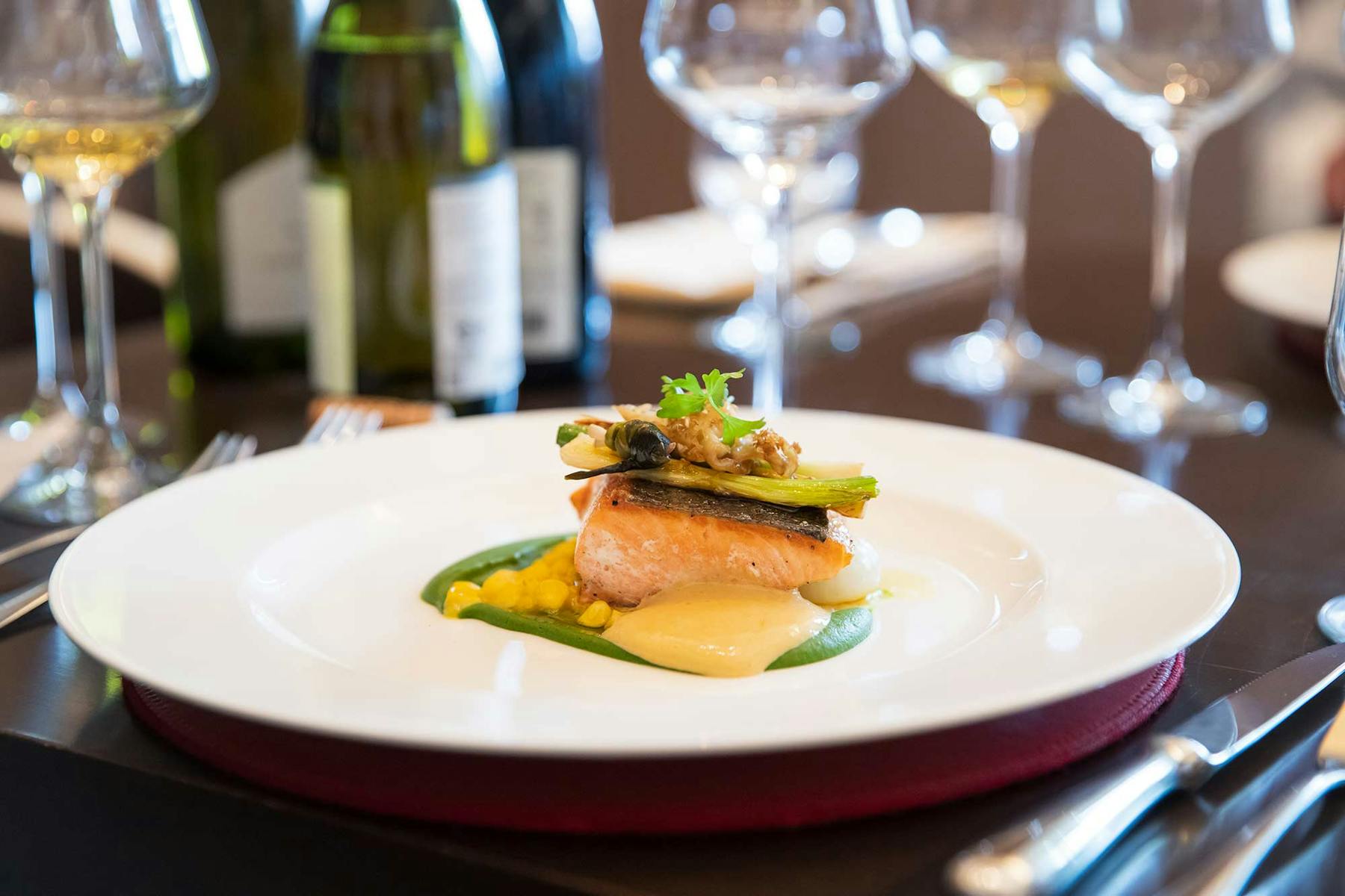 Plated dish of fish and vegetables served at the American Bounty restaurant, on the campus of The Culinary Institute of America in Hyde Park, NY.