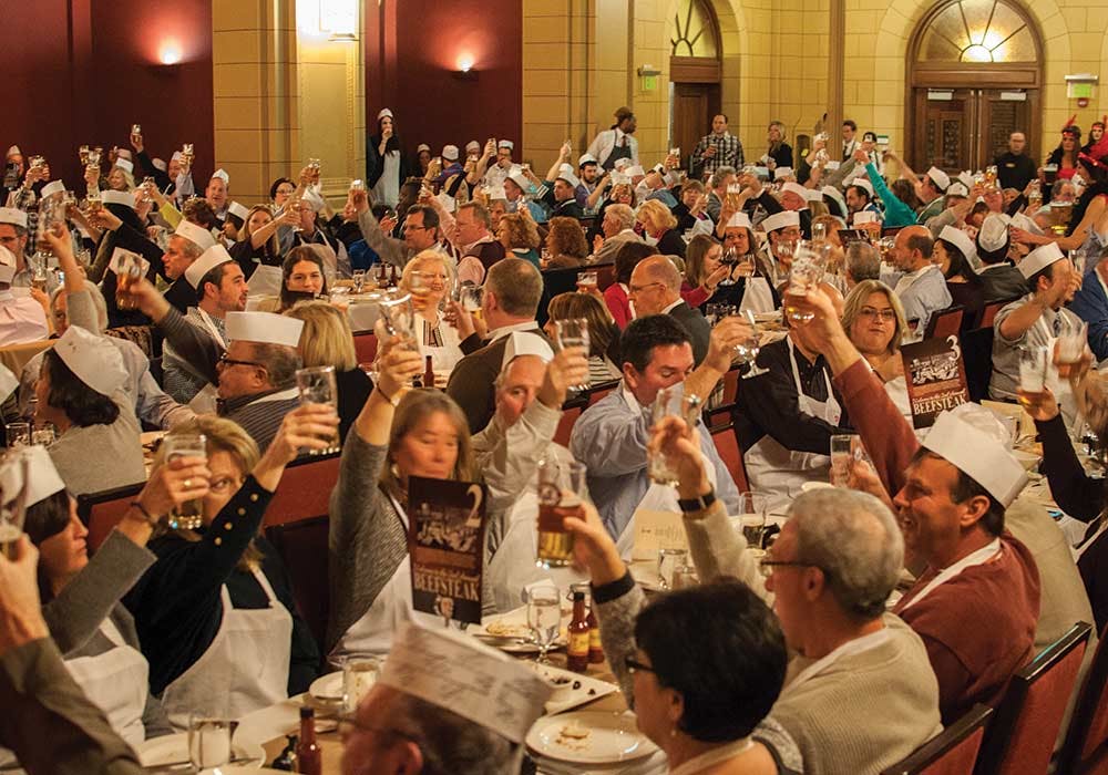 People enjoying the annual Beefsteak event at the CIA