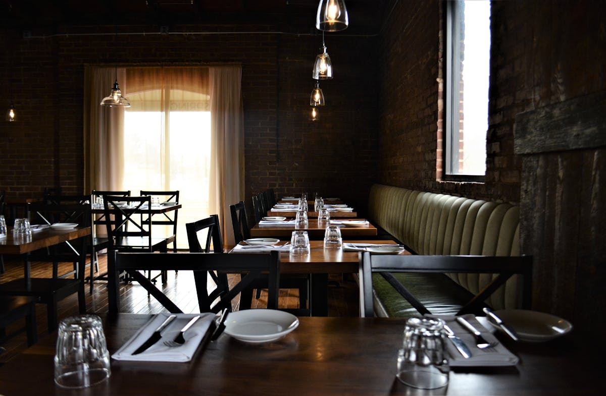 a dining room table in front of a window