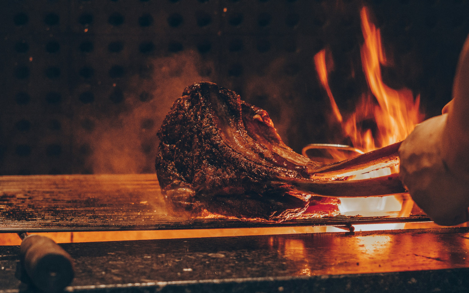 a meat being cooked on a grill