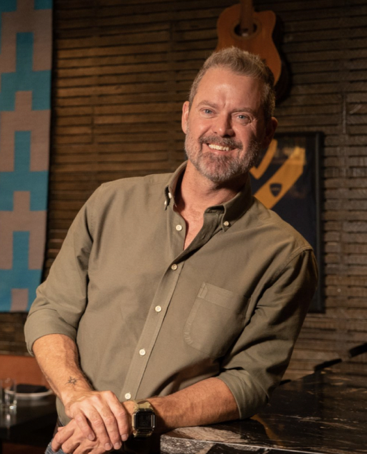 a man smiling at camera