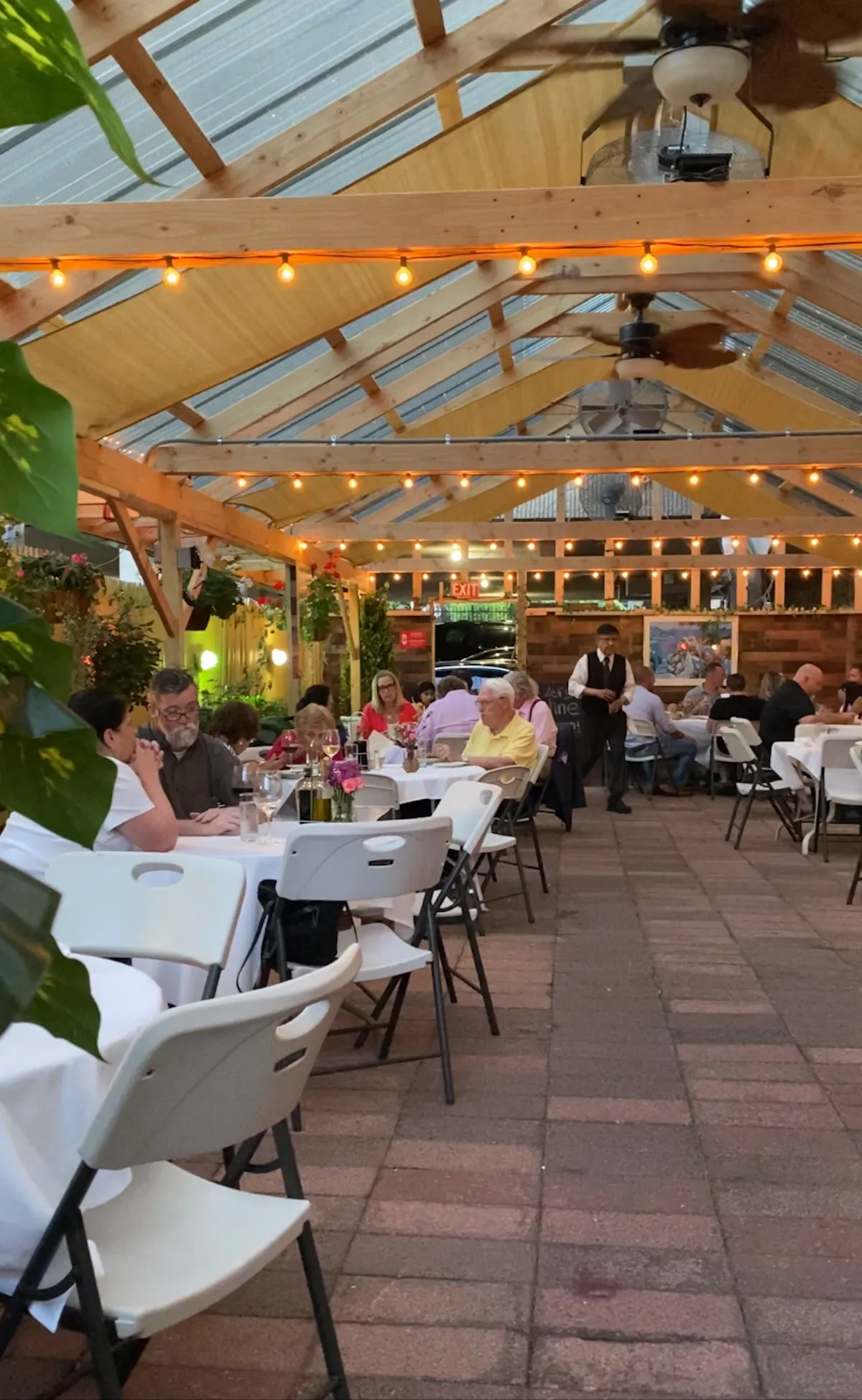 a group of people sitting at a table in a restaurant