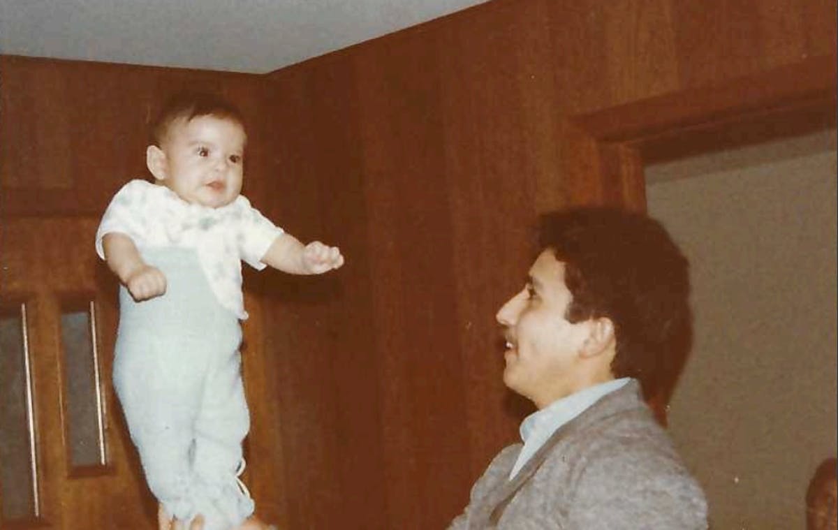 an adult holding a baby
