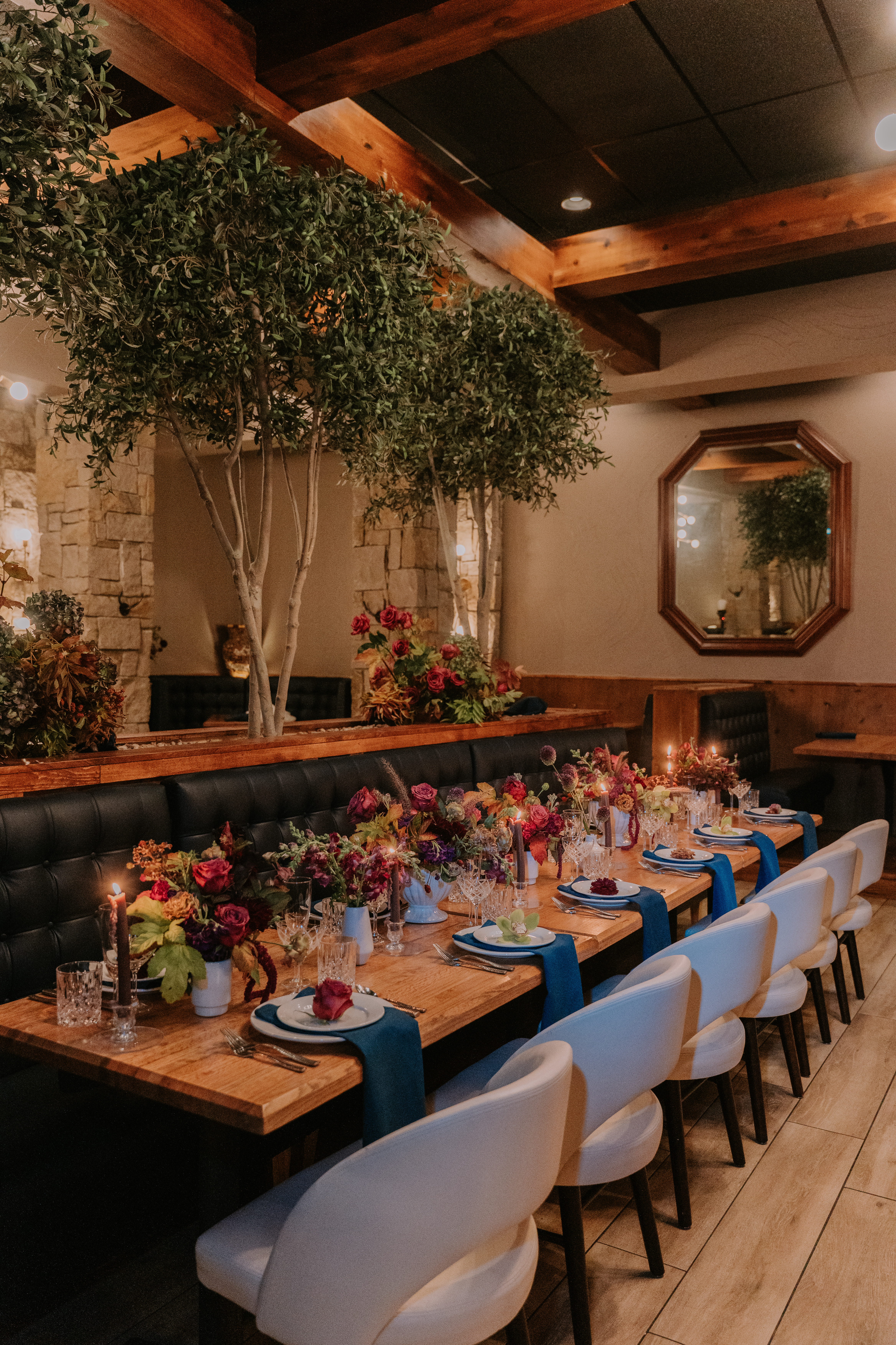 a room filled with furniture and vase of flowers on a table