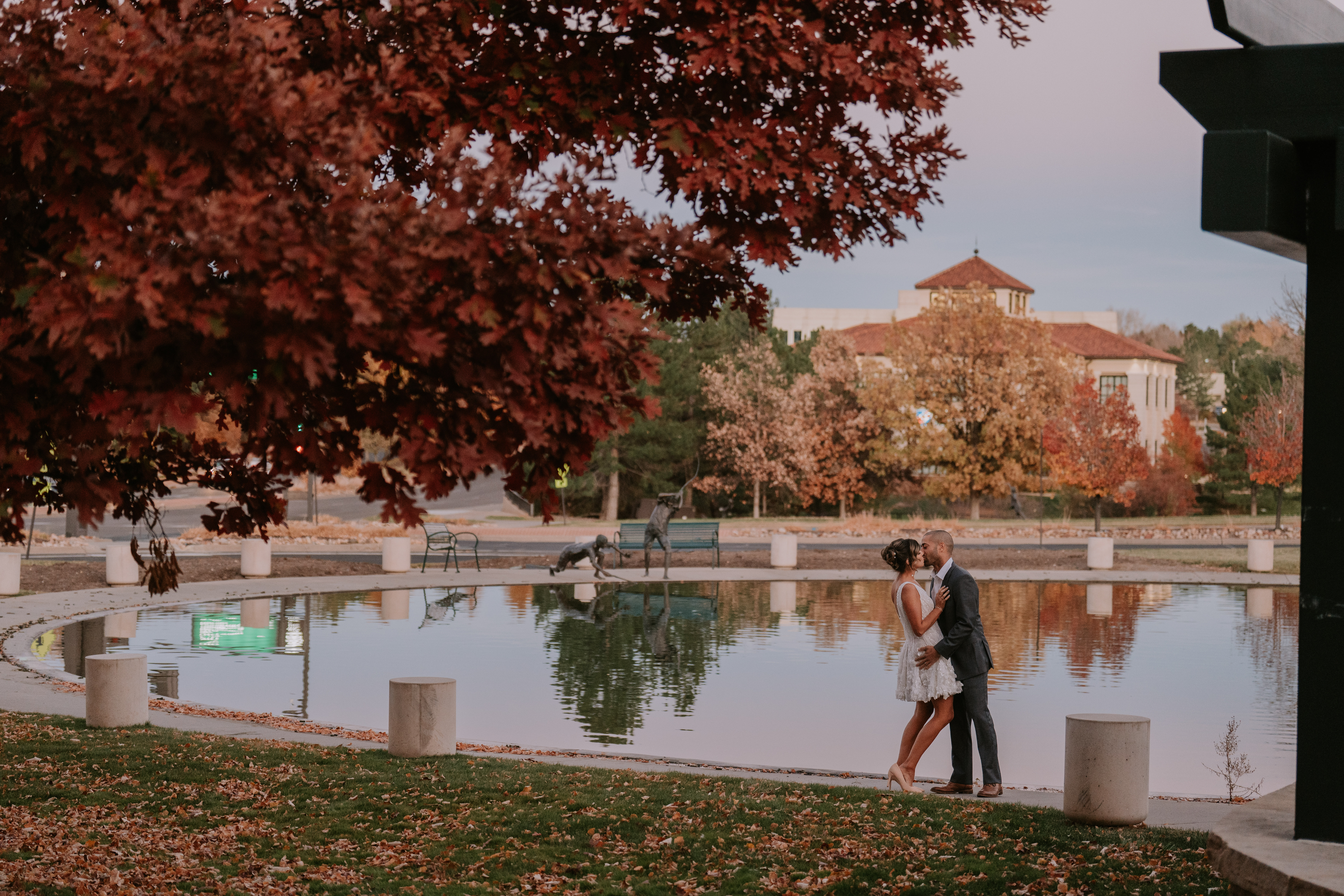 a man standing next to a river