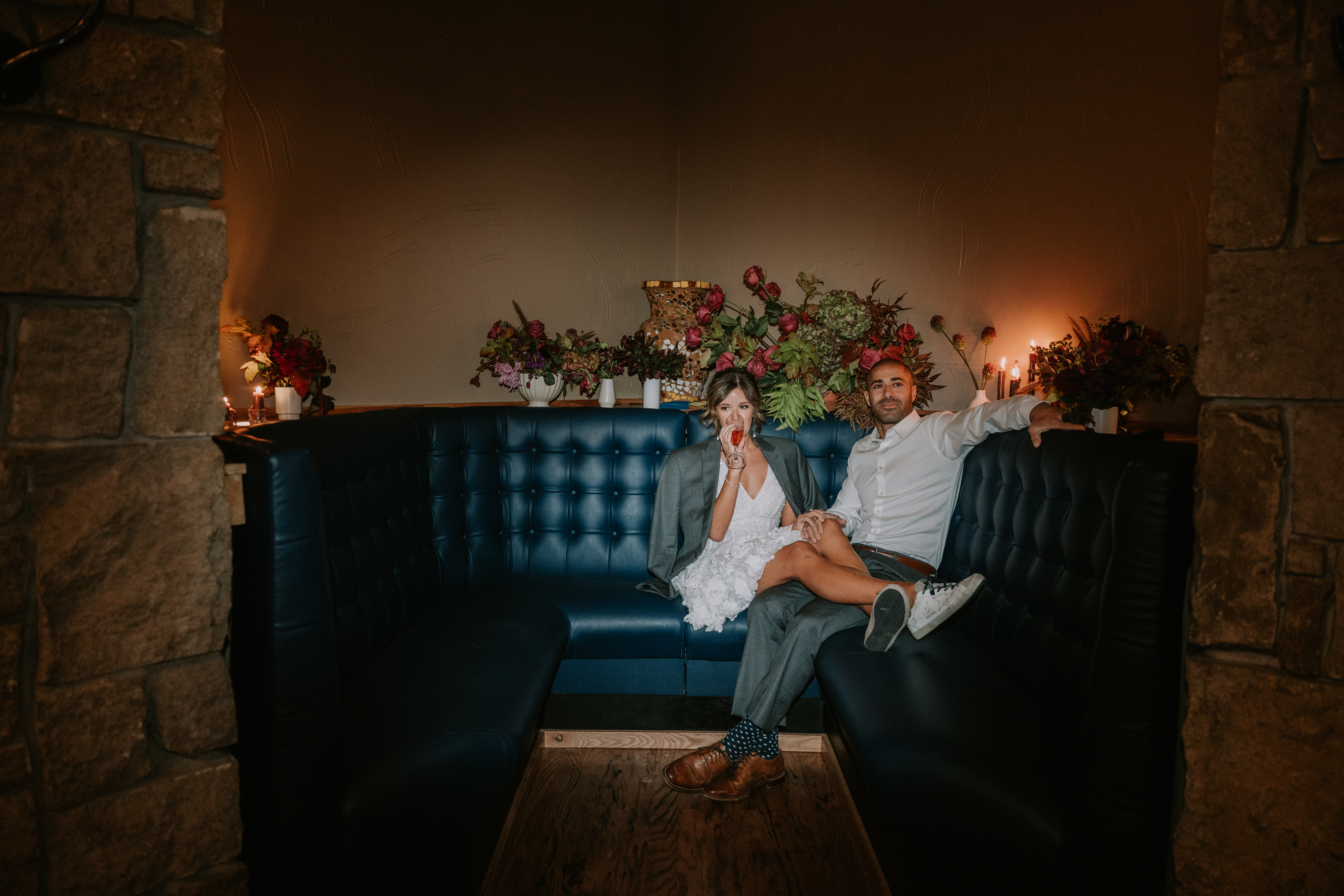 a person sitting in front of a fireplace