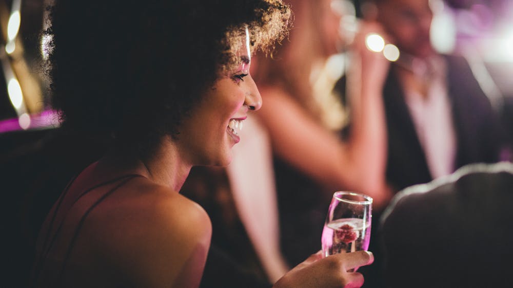 a person holding a wine glass