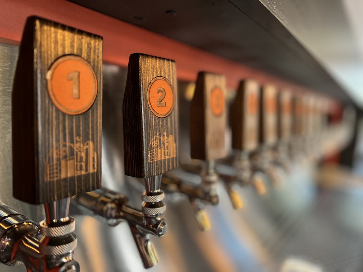 a close up of a line of taps
