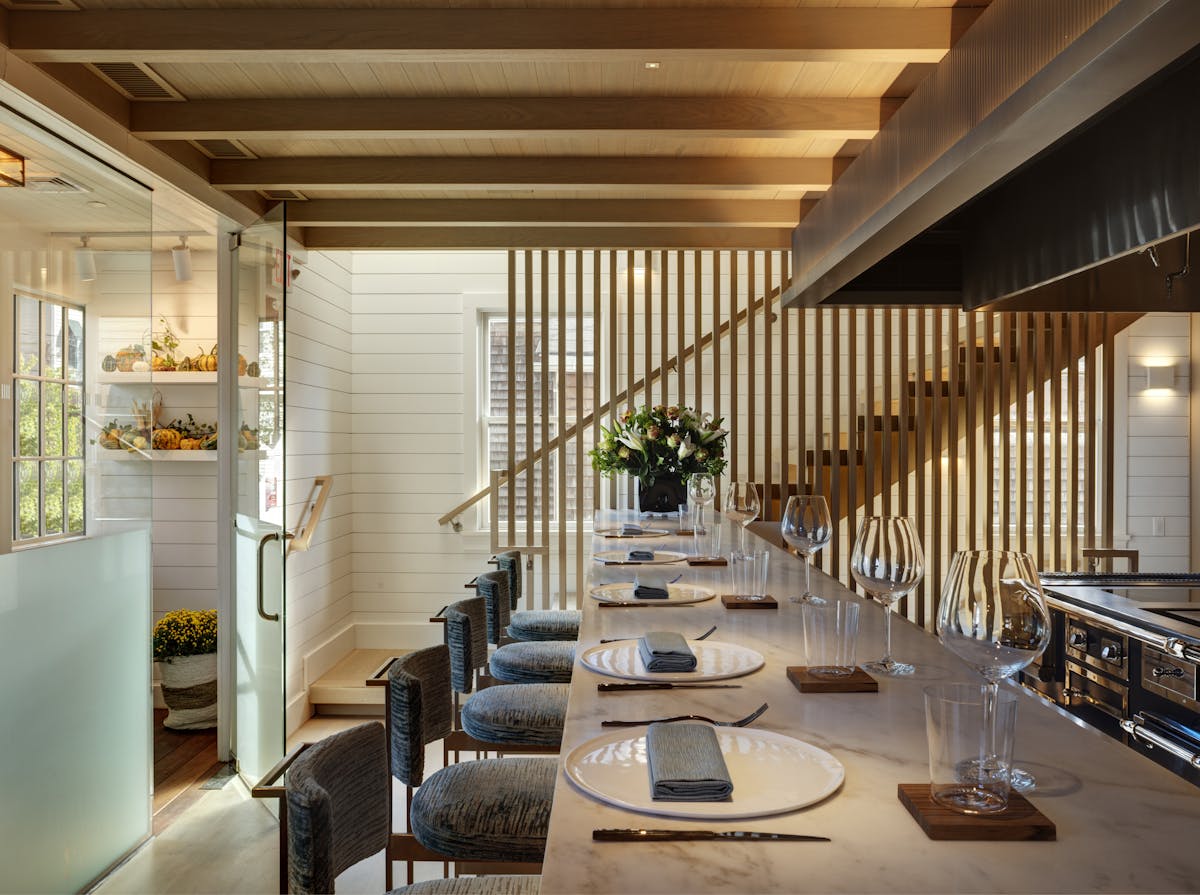 a dining room table in front of a building