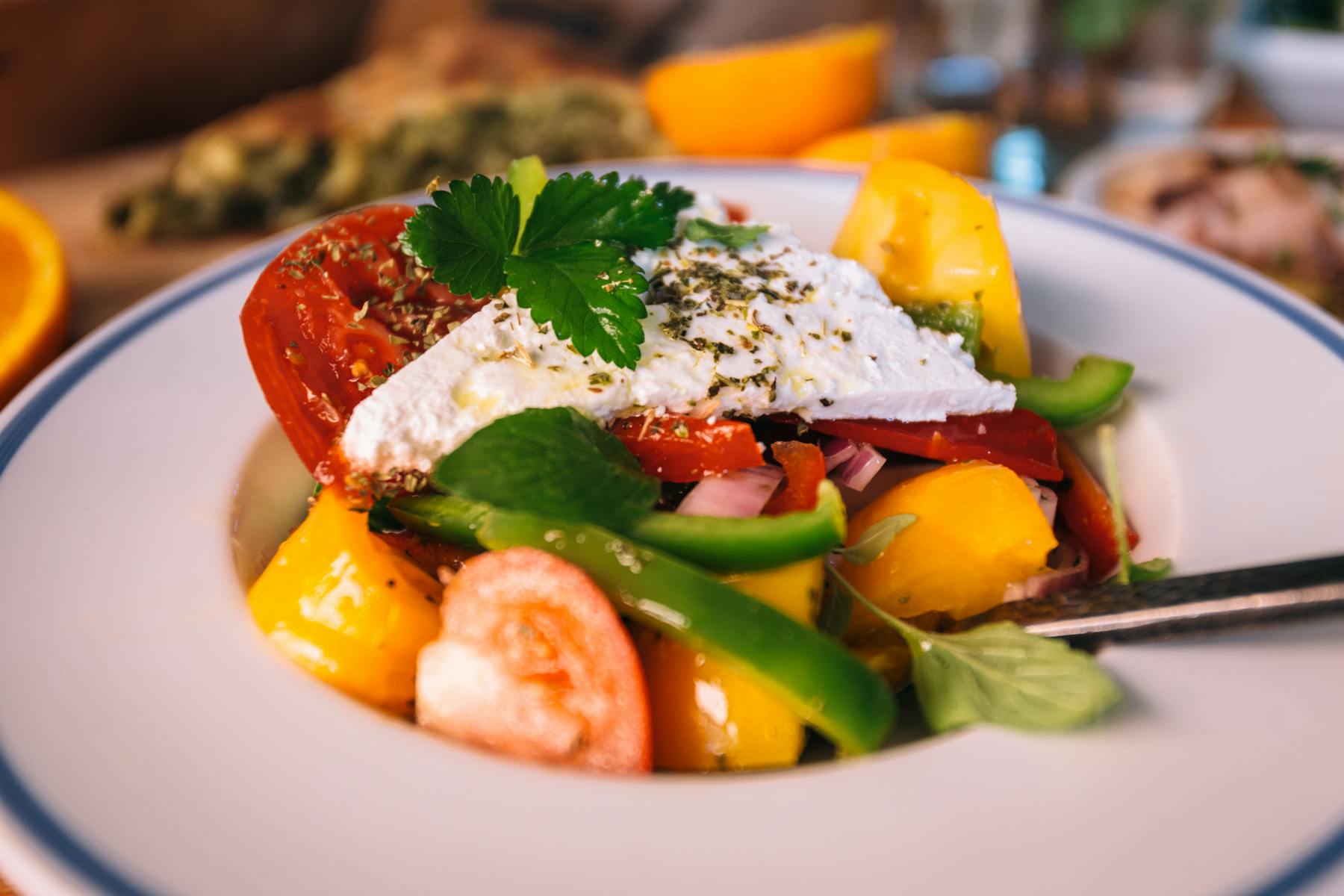 a plate of food with a slice of orange