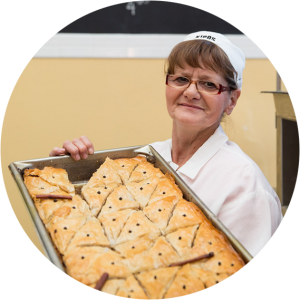 a person holding a sign posing for the camera