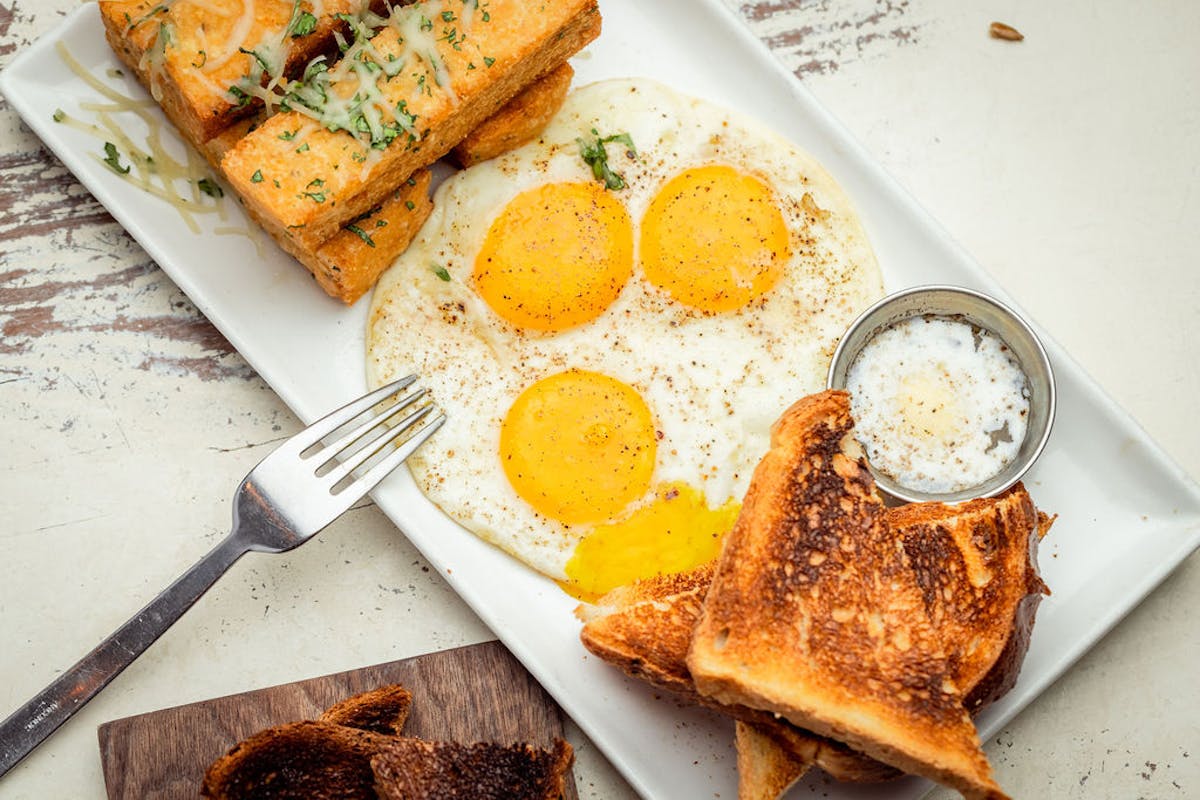 a plate of food with a slice of bread