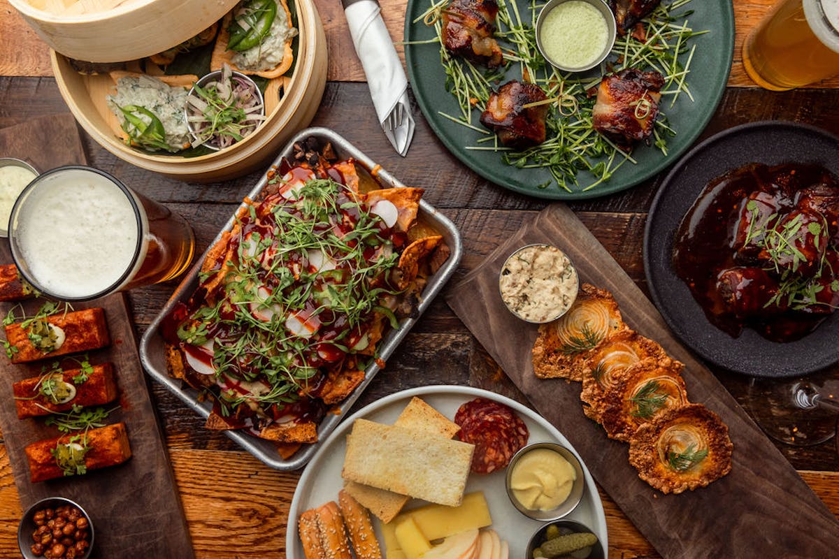 a bunch of food sitting on top of a wooden table