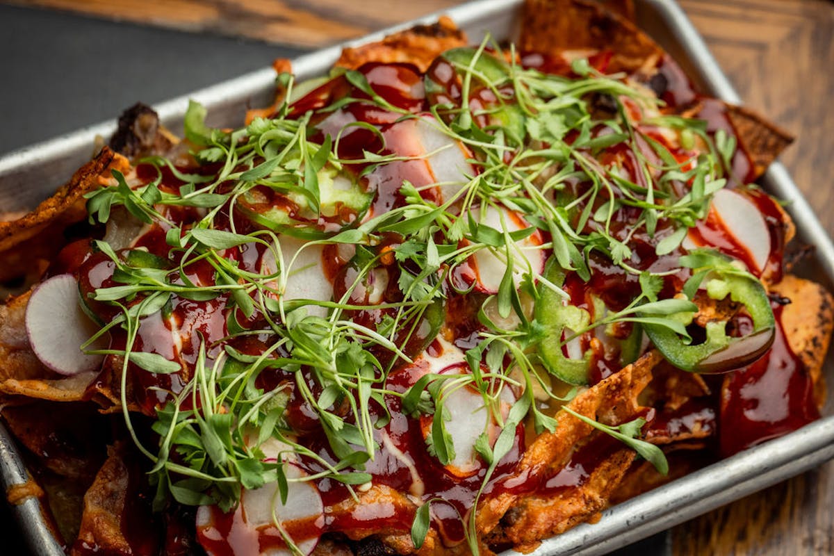 a plate of food with a slice of pizza