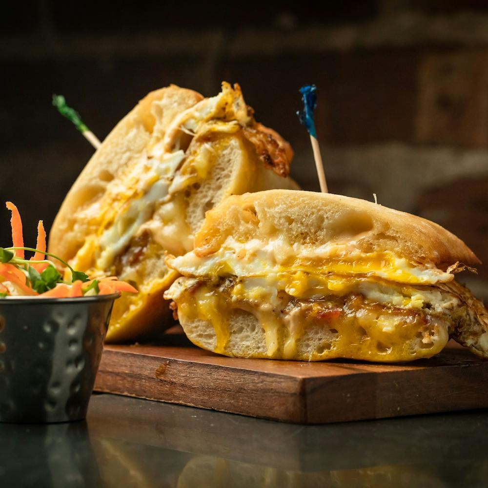 a sandwich sitting on top of a wooden table