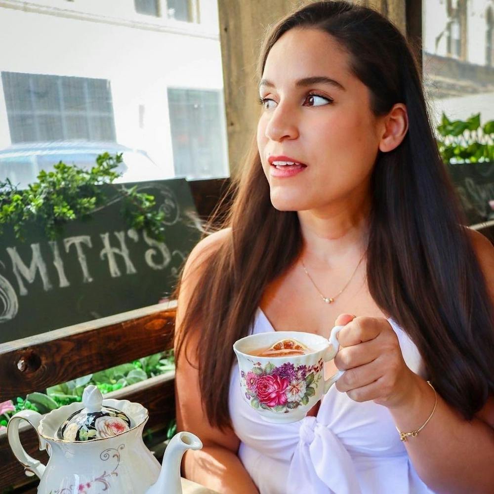 a woman holding a teacup
