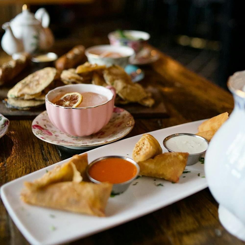 a plate of food and a cup of coffee on a table