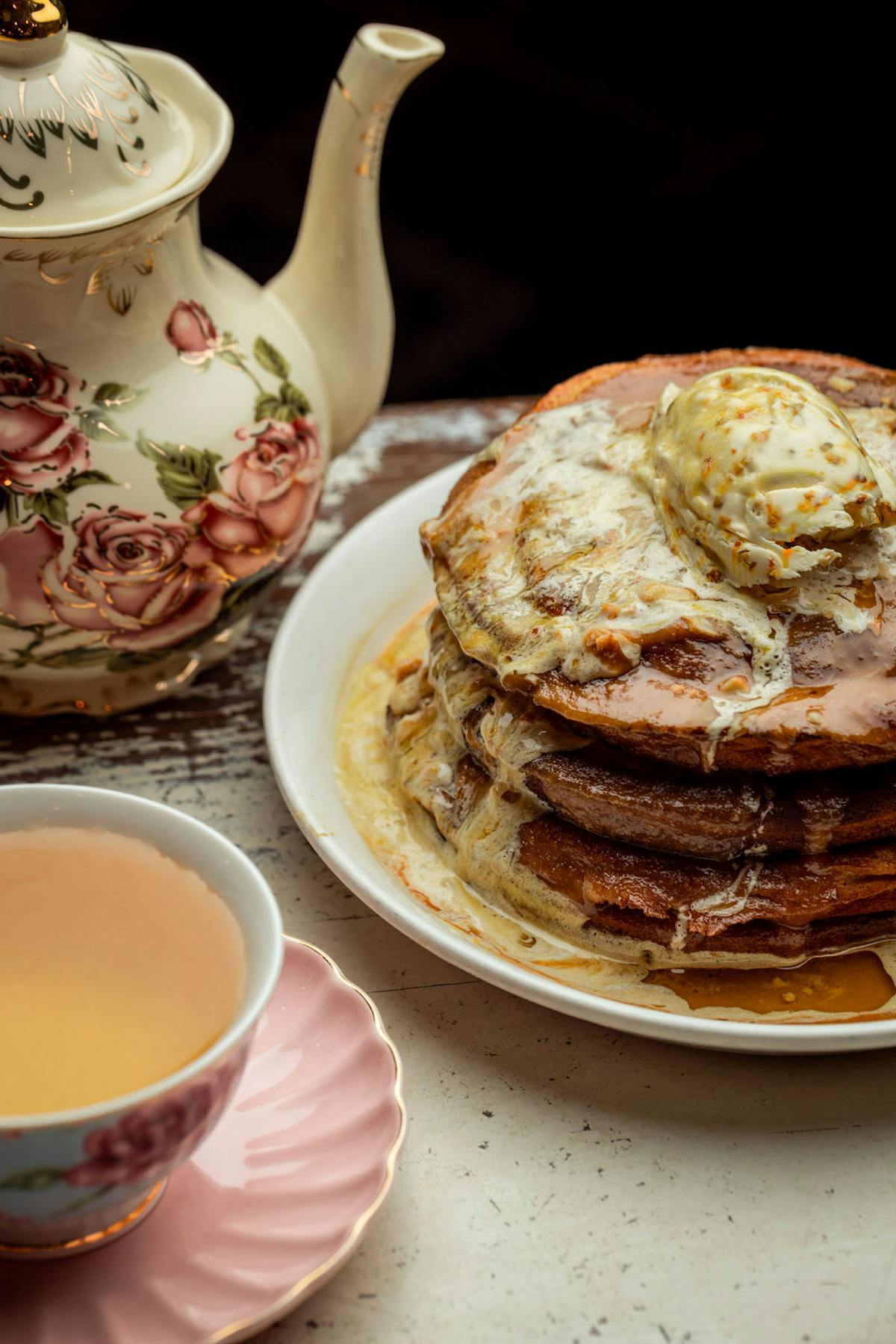 a plate of food and a cup of coffee