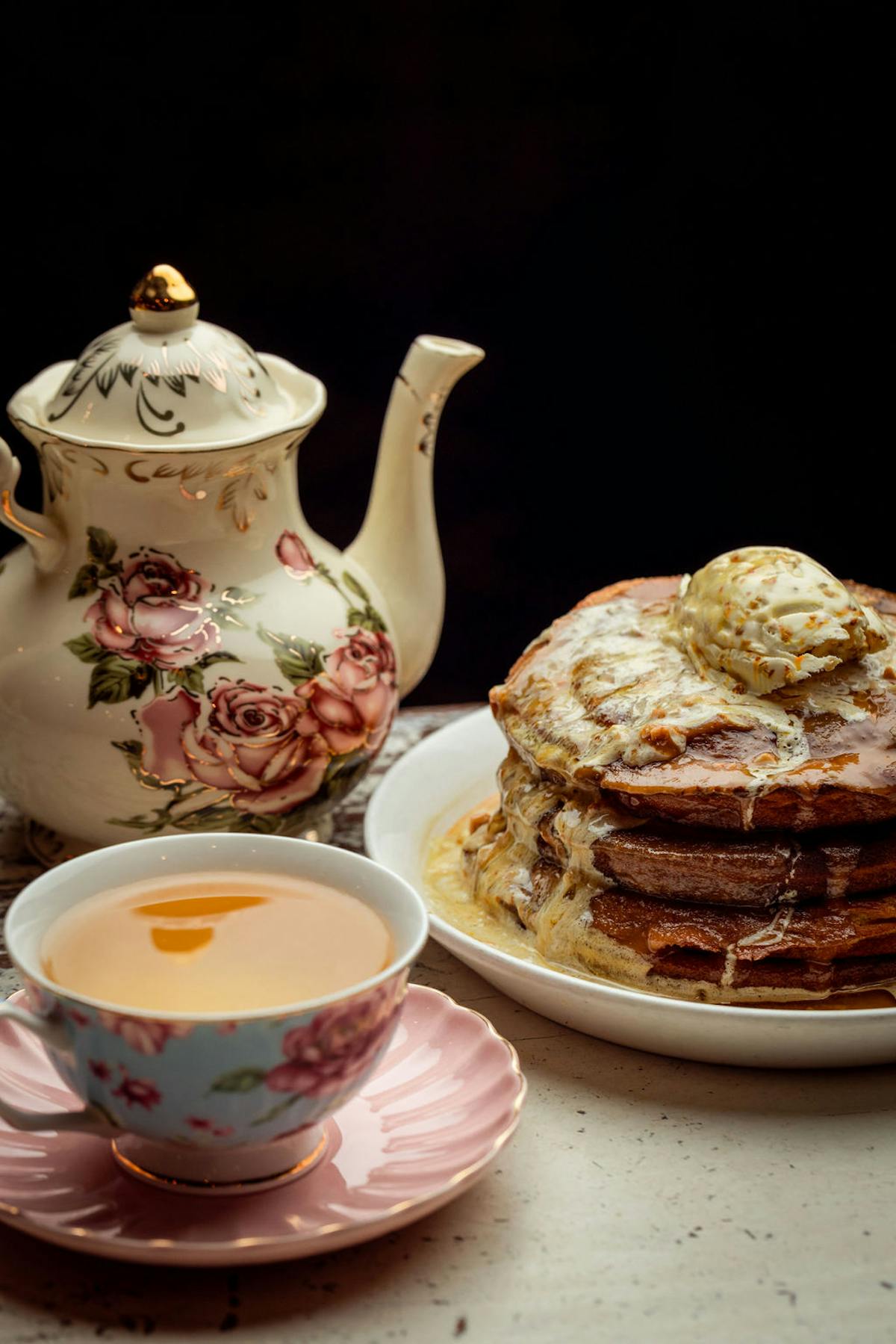 a plate of food and a cup of coffee