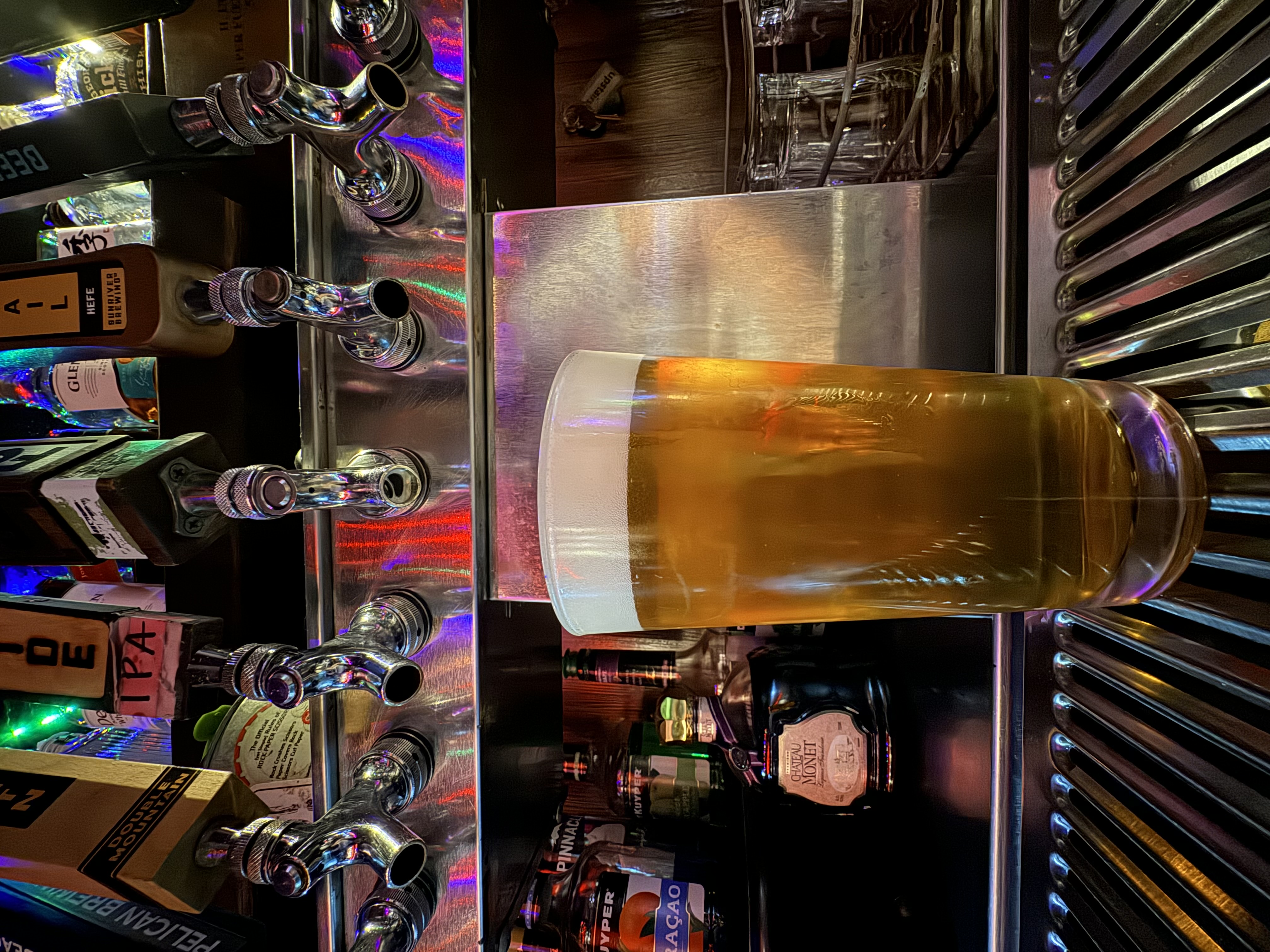 a glass of beer on a table