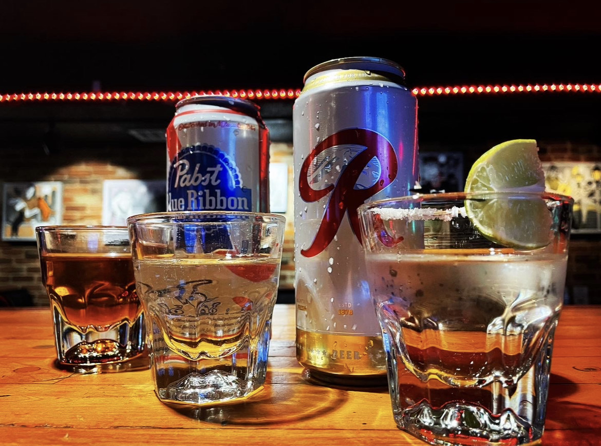a group of glass bottles on a table