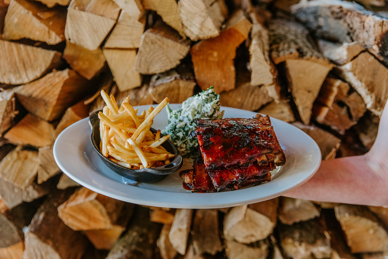 a plate of ribs and fries