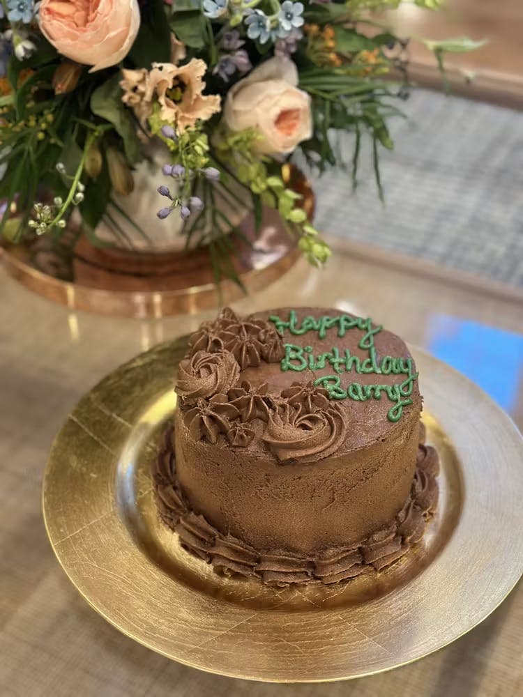 a piece of cake sitting on top of a wooden table