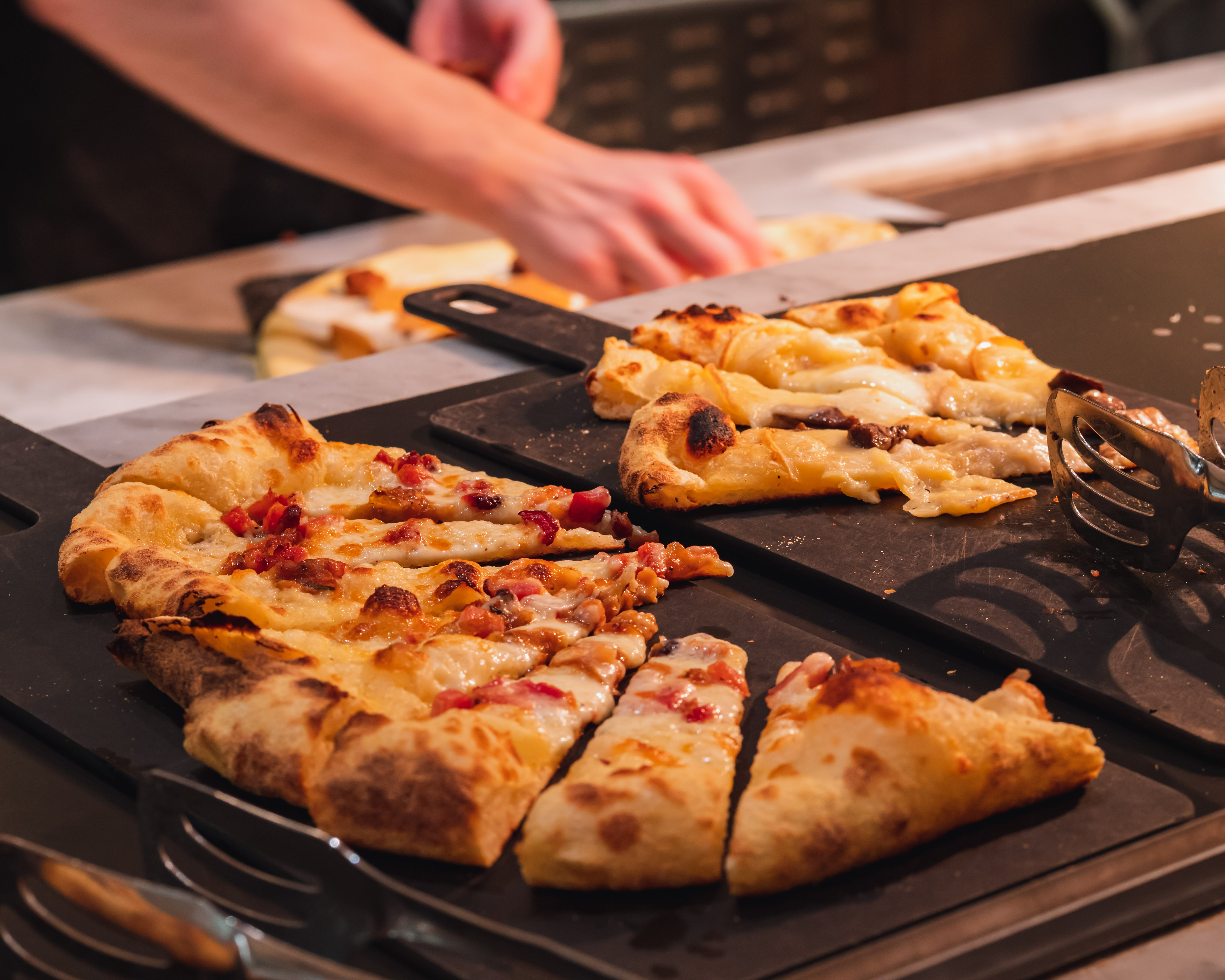 a pizza sitting on top of a cutting board