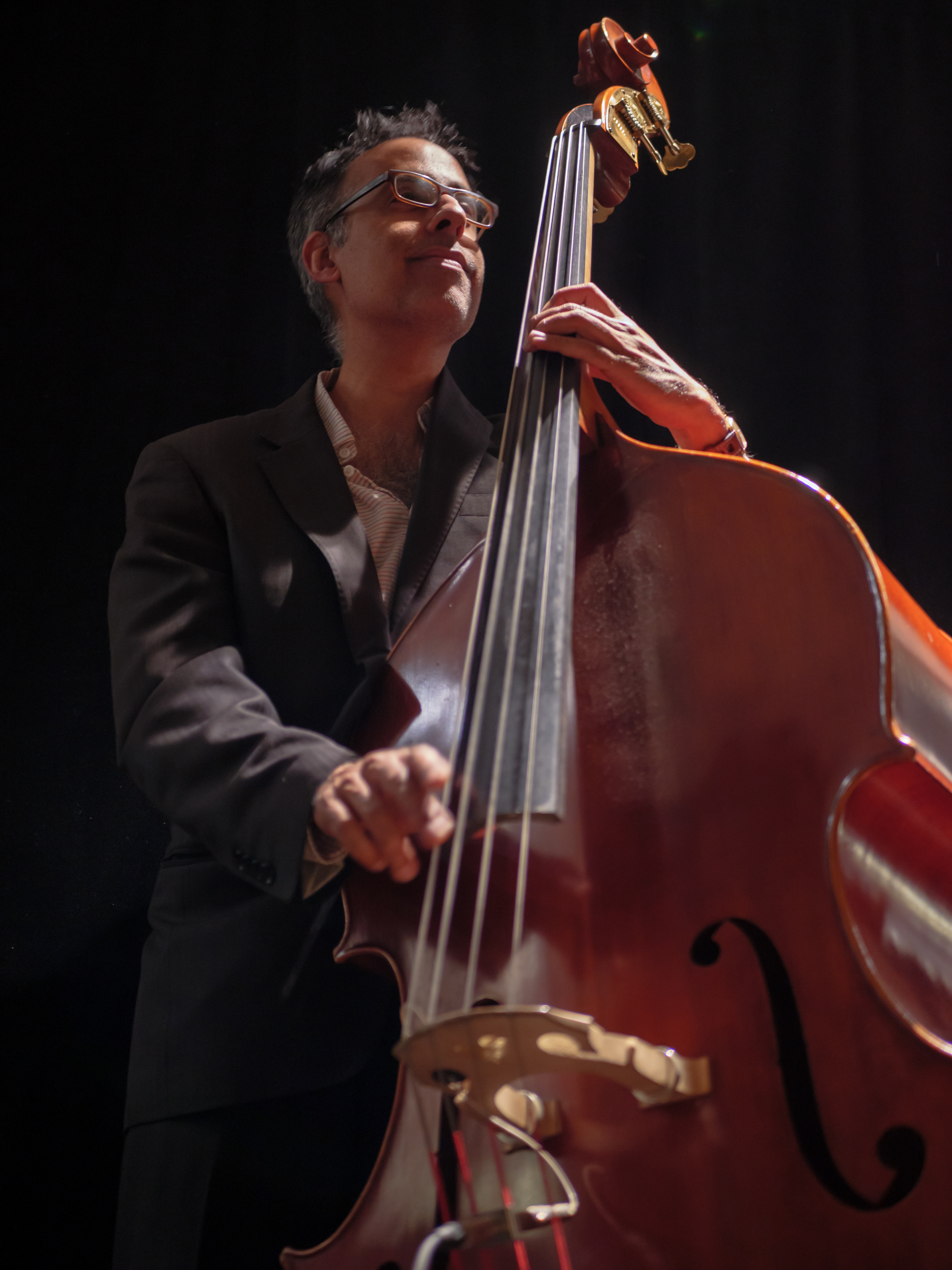 a man standing in front of a instrument