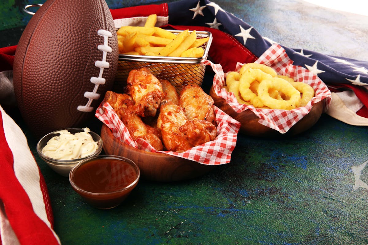 chicken wings, fries, onion rings, football, American flag