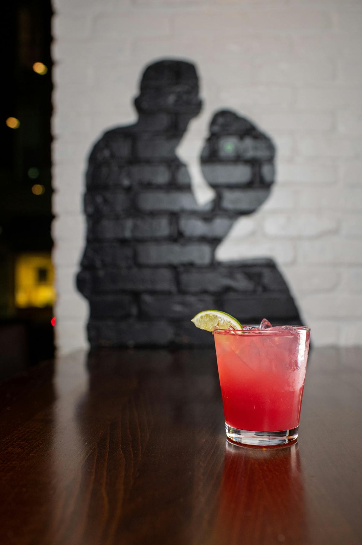 a cocktail sitting on top of a wooden table