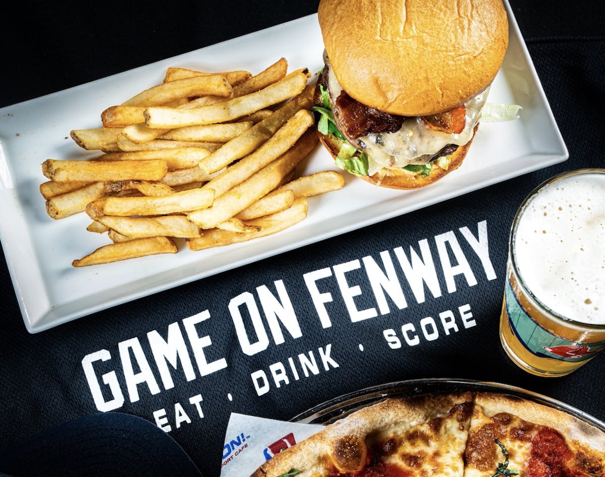 a plate of food with a sandwich and fries on a table