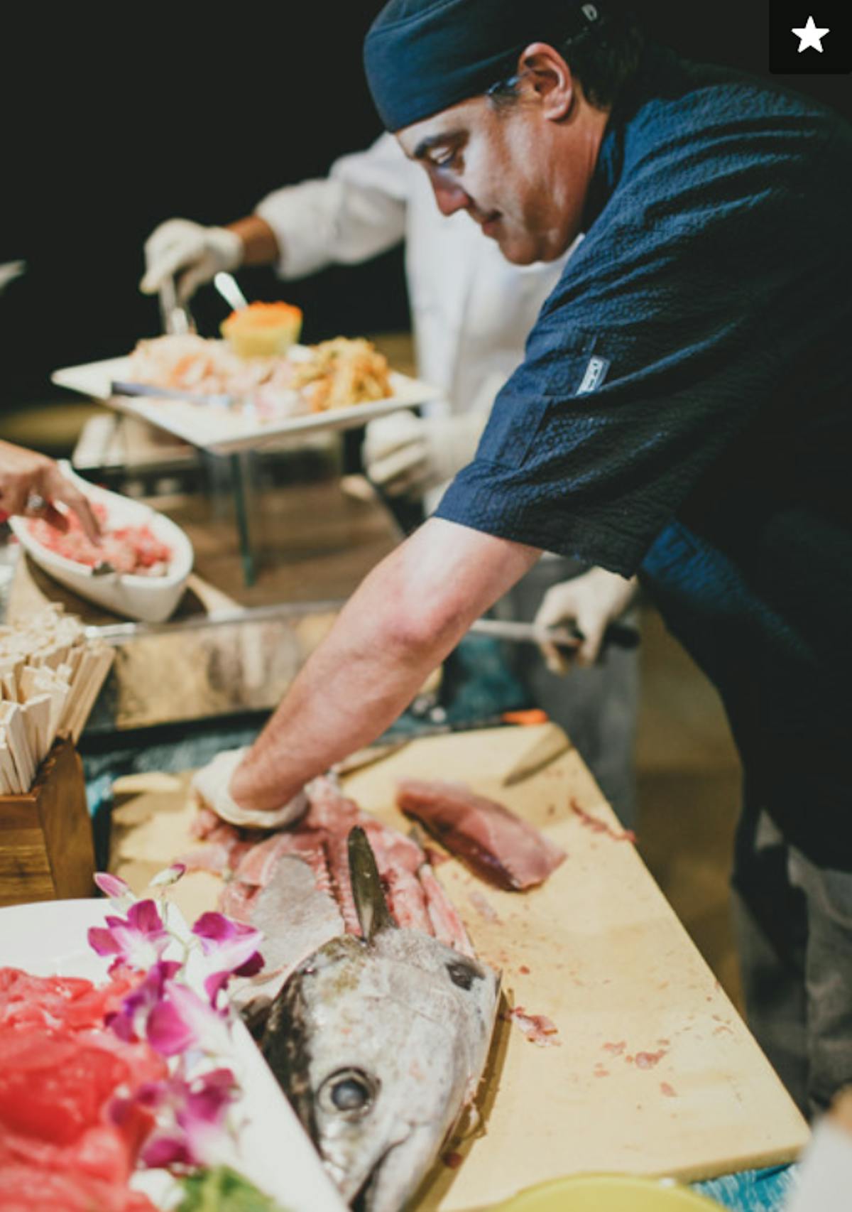 a man cutting food on a table