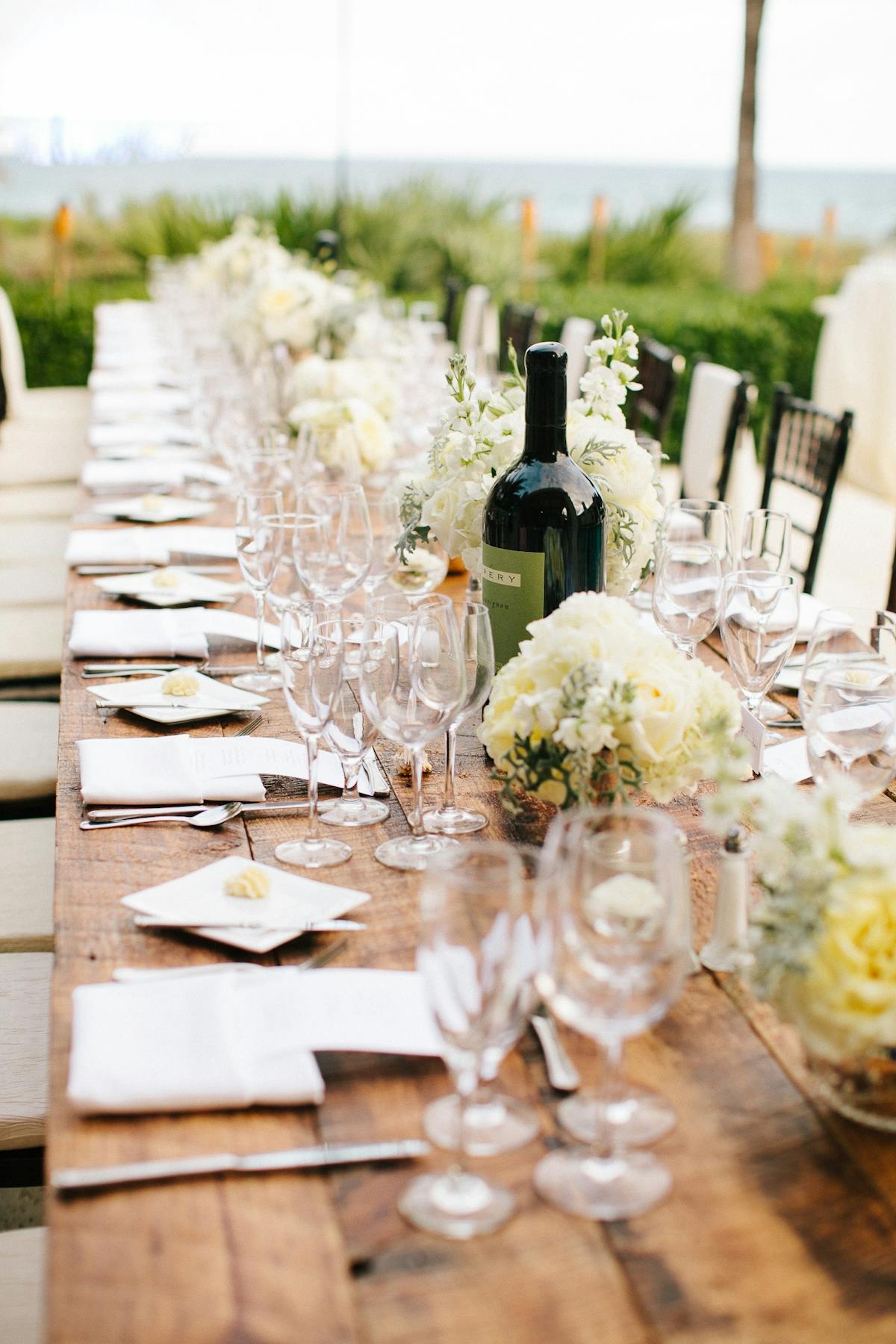 a group of people sitting at a table with wine glasses