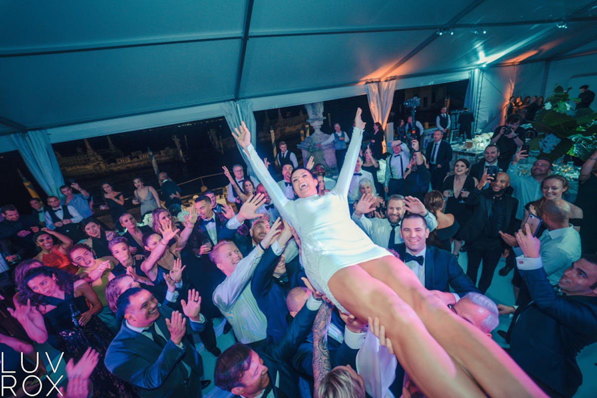 a group of people on a stage in front of a crowd