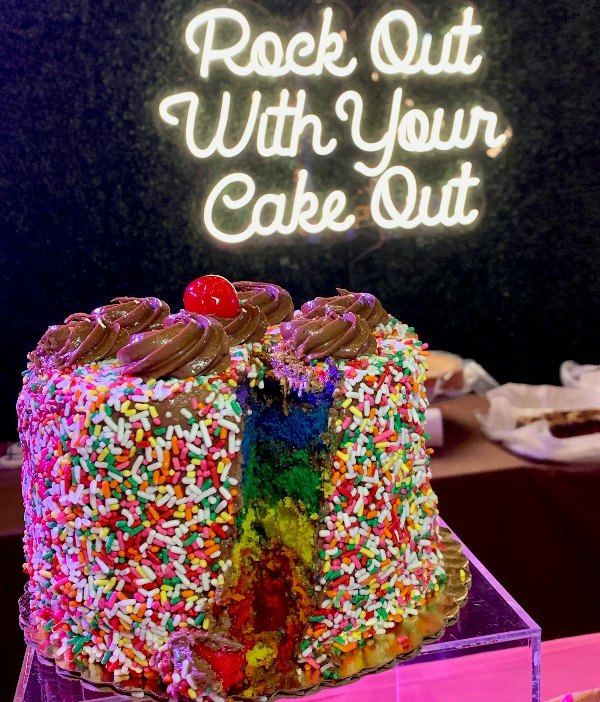 a sign in front of a cake