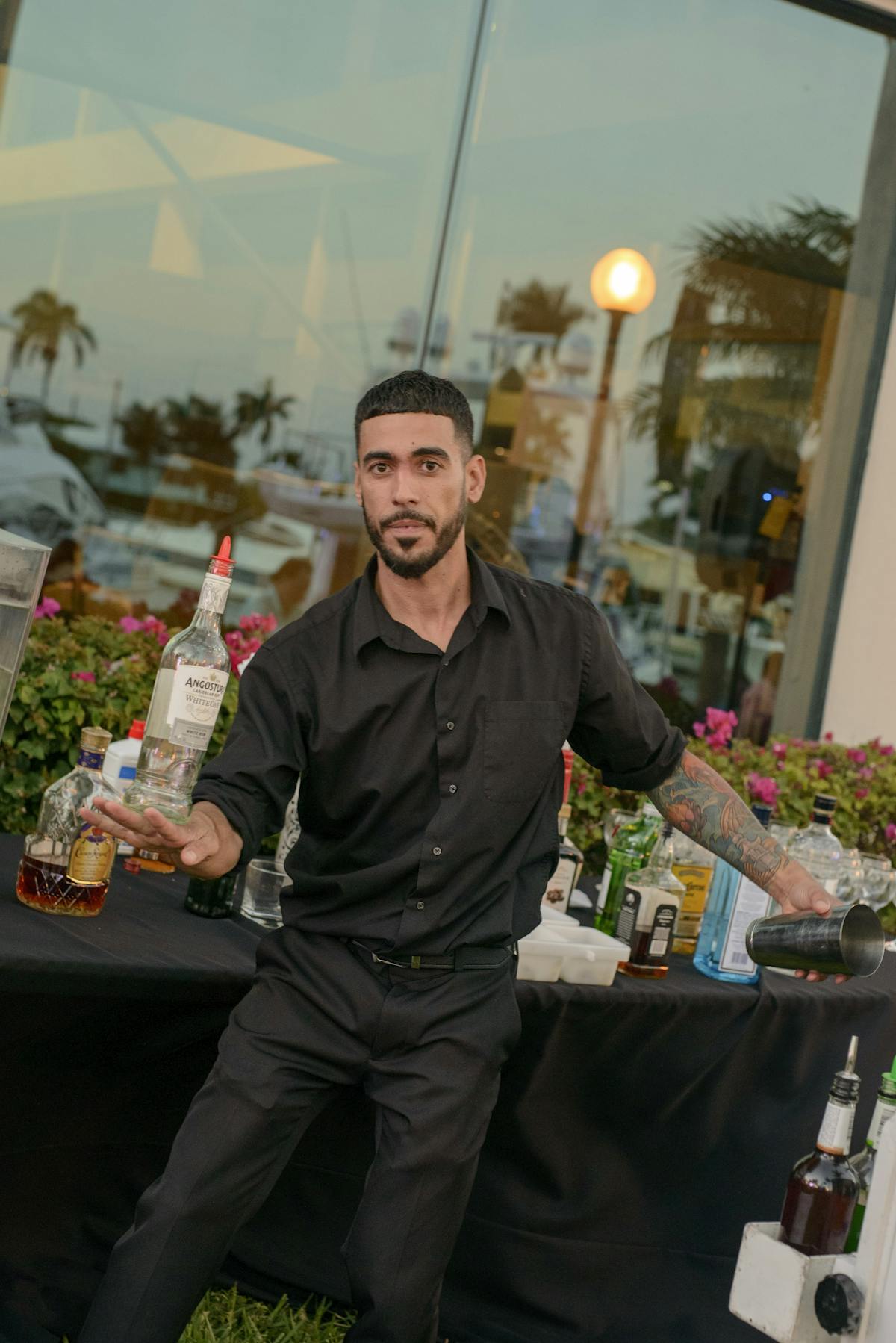 a man standing in front of a table