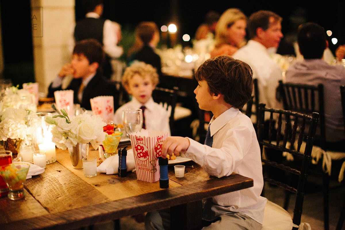 a group of people sitting at a table in a restaurant