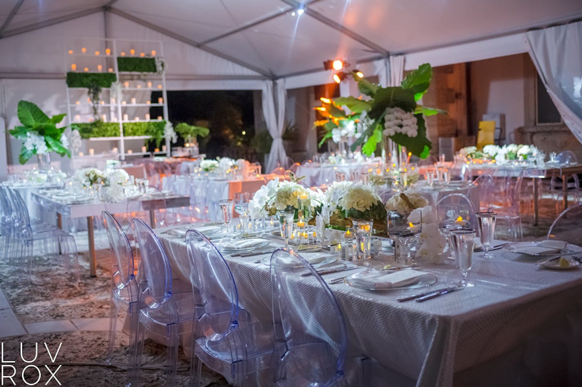 a dining table filled with wine glasses