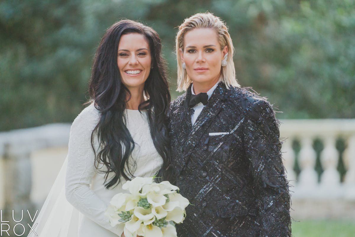 Ali Krieger, Ashlyn Harris are posing for a picture