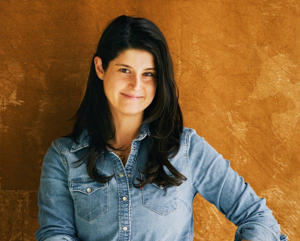 a woman smiling for the camera