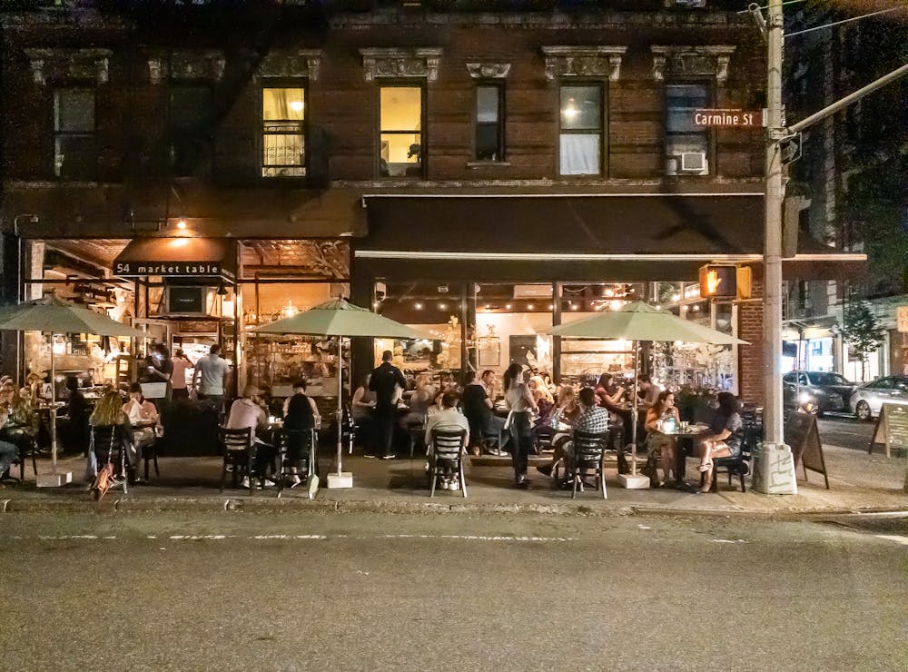 a group of people standing in front of a building